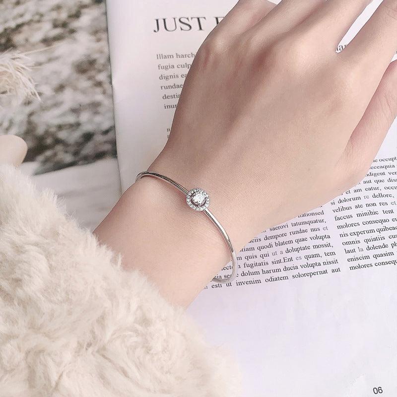 Single Halo Diamond Bangle. 925 Silver